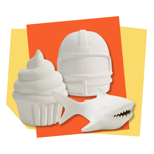 Unpainted coin banks on a yellow and orange background