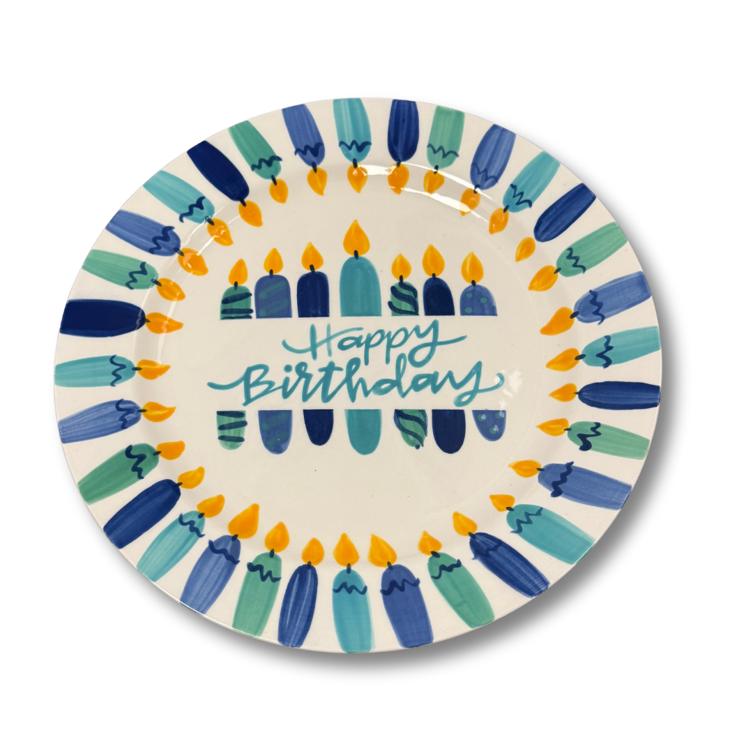 Decorative plate with blue and green candles and 'Happy Birthday' text on a white background