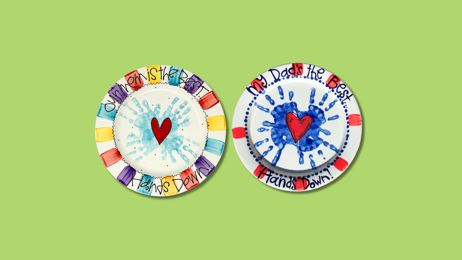 Two colorful plates with heart and hand print designs and text on a green background
