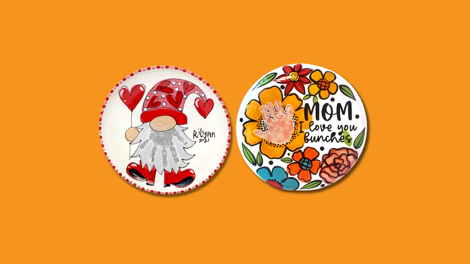 Two decorative plates with a gnome and floral design on an orange background