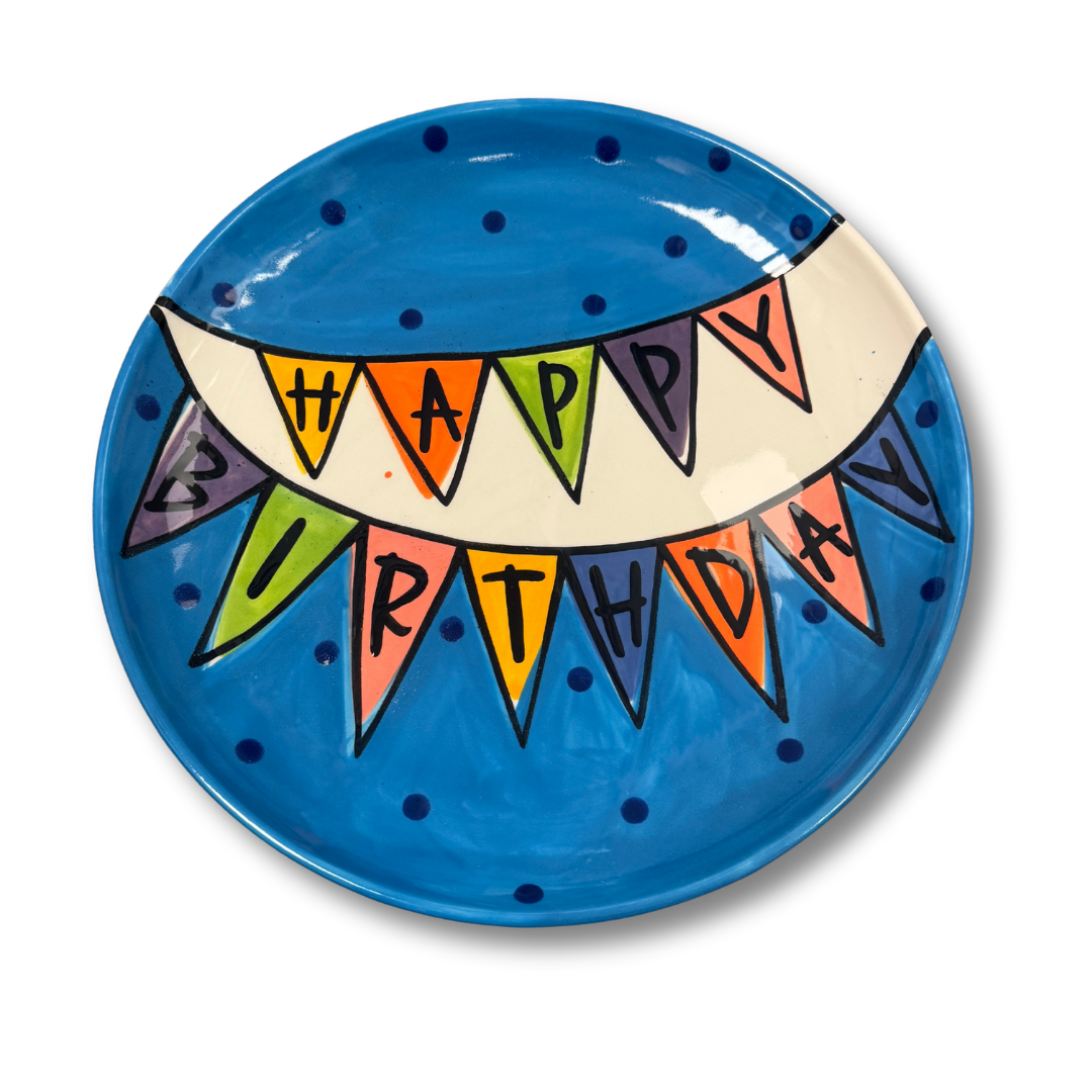 Decorative plate with 'Happy Birthday' banner design on a blue background