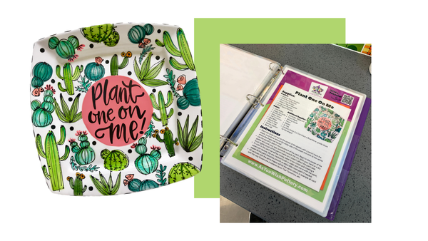 Decorative plate with cactus design and a binder with printed material on a white background