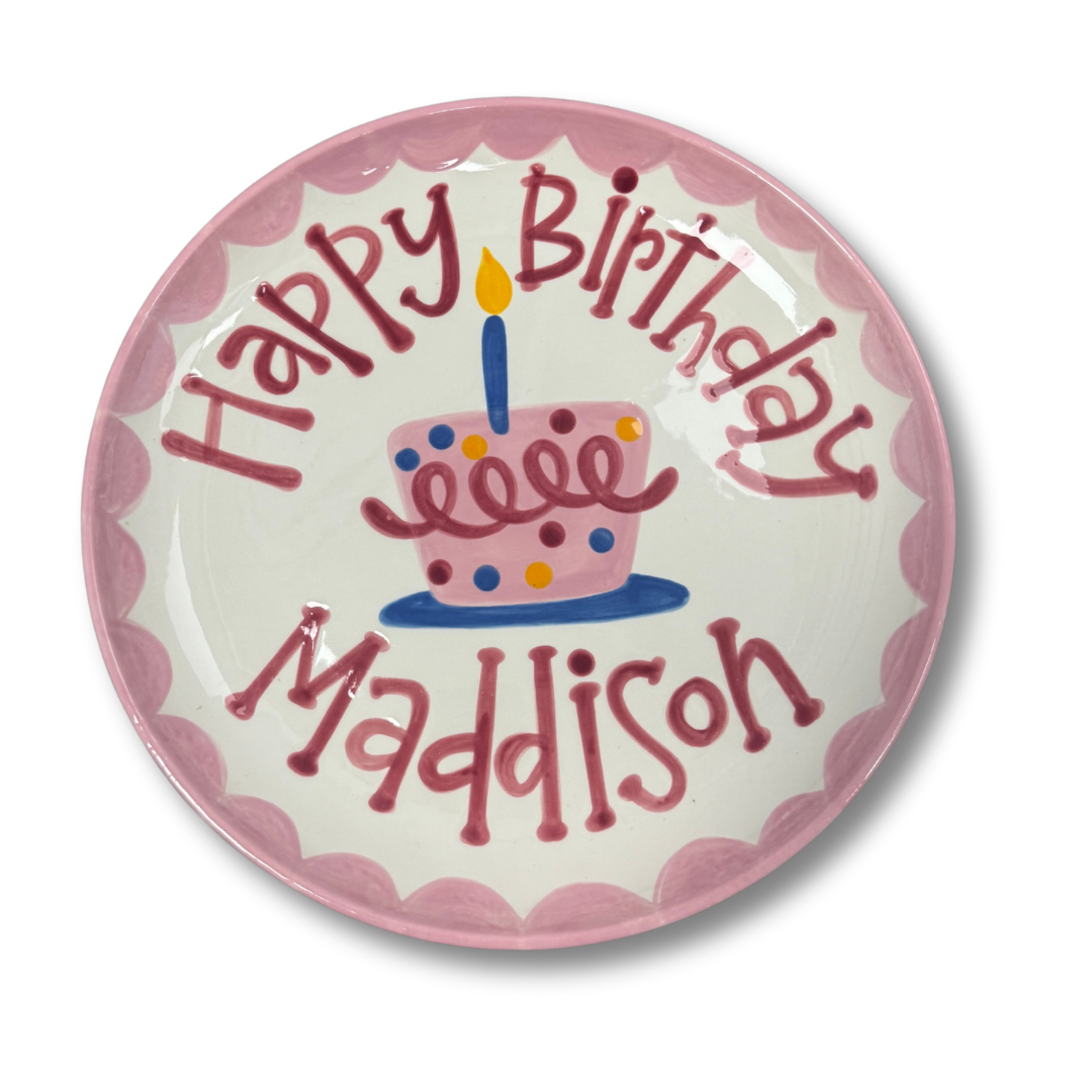 Personalized birthday plate with a cake design and 'Happy Birthday Maddison' text on a white background.